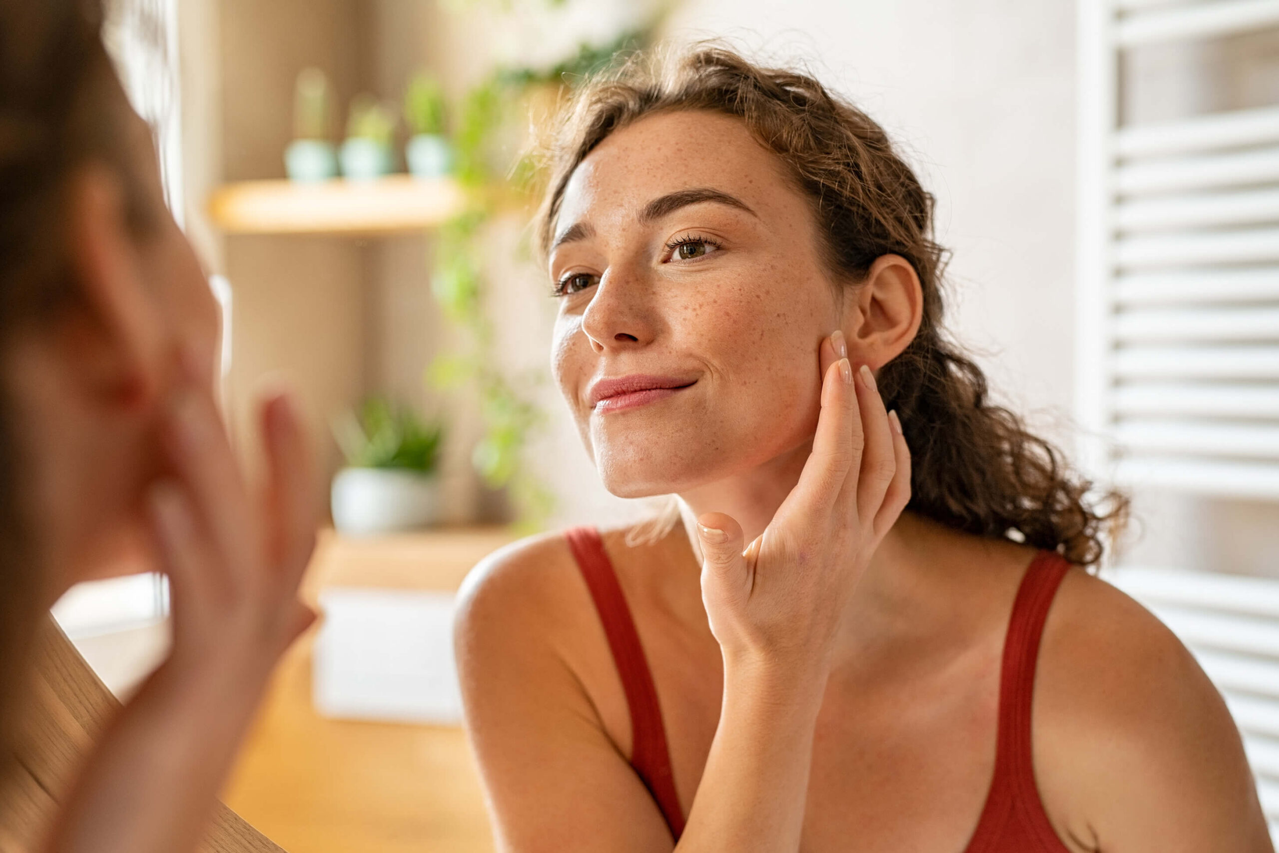 a women looking at the results of a treatments after booking a consultation to deal with sun damage